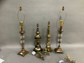 A pair of gilt composite and glass table lamps, the supports formed of glass knops on four feet 46cm