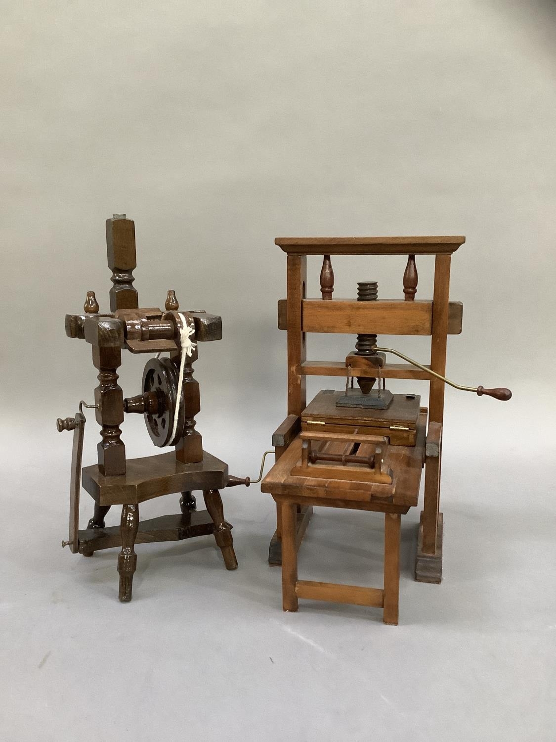 A model printing press and a spinning wheel