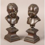 A pair of late 19th century bronze busts of infants, after Messerschmidt (1736-1783), one