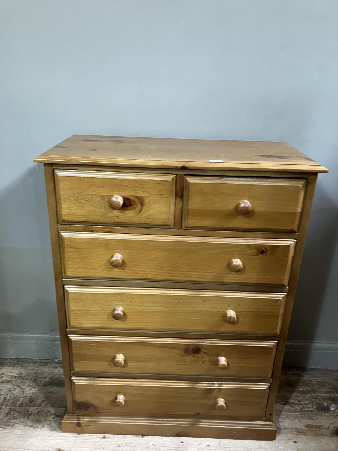 A modern pine chest of two short above four long drawers together with a pine bedside chest of three