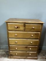 A modern pine chest of two short above four long drawers together with a pine bedside chest of three