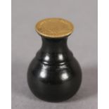 An ebony seal with a George III one-third Guinea Matrix (the coin c1797-1813), 3cm high (Shipping