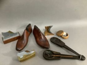 Two wooden shoe lasts, a treen trinket box with carved lid, three metal models of shoes, a wooden