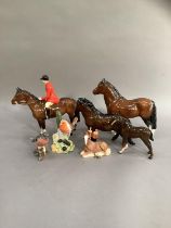 A Beswick huntsman and horse, a Shetland pony and a donkey foal, a chaffinch and a robin beside a