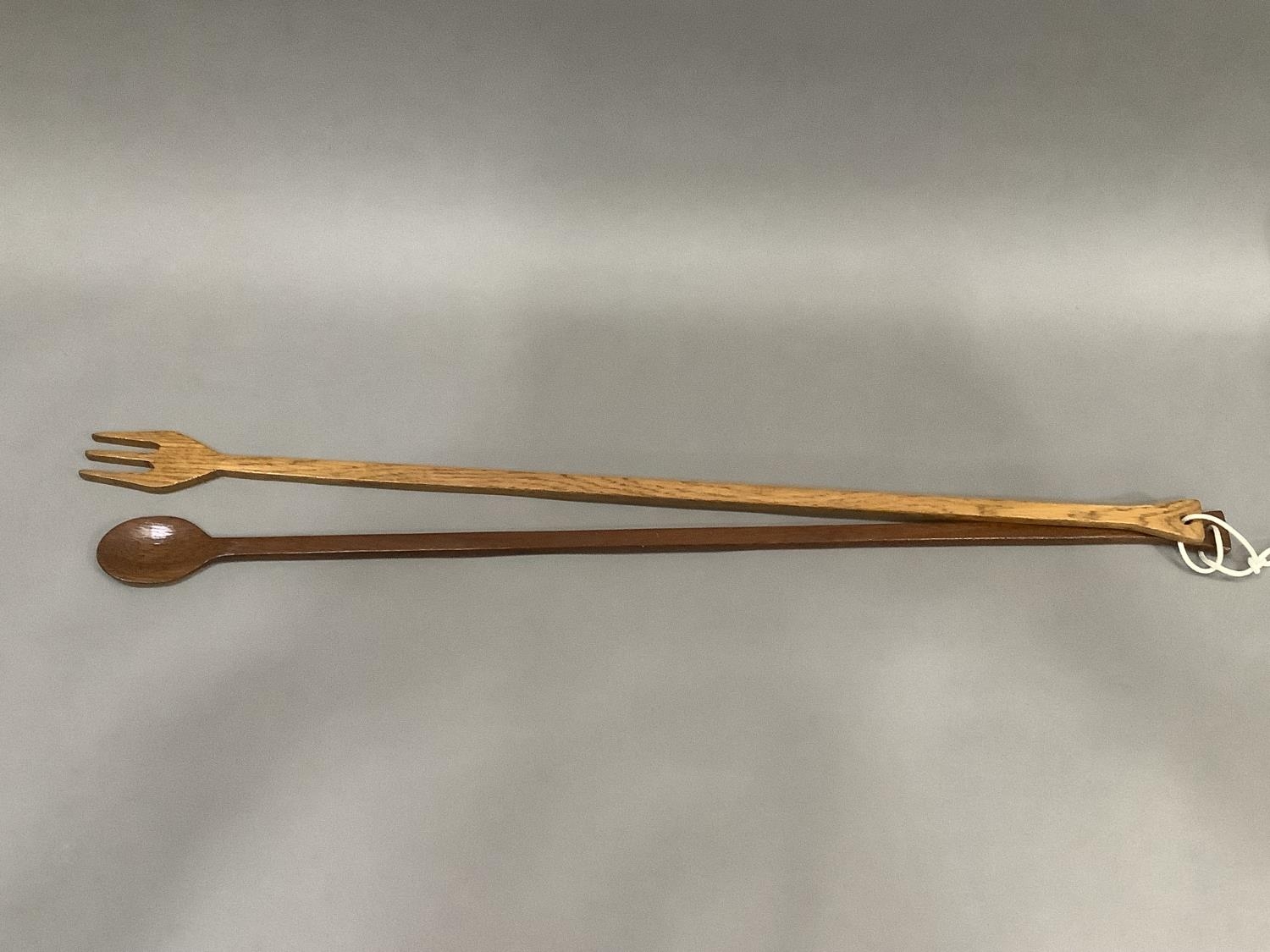 A long handled treen fork and spoon, 76cm length