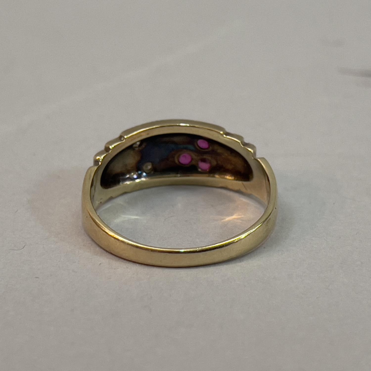 A ruby and diamond ring in 9ct gold, the small circular facetted rubies and eight cut diamonds, - Image 2 of 2