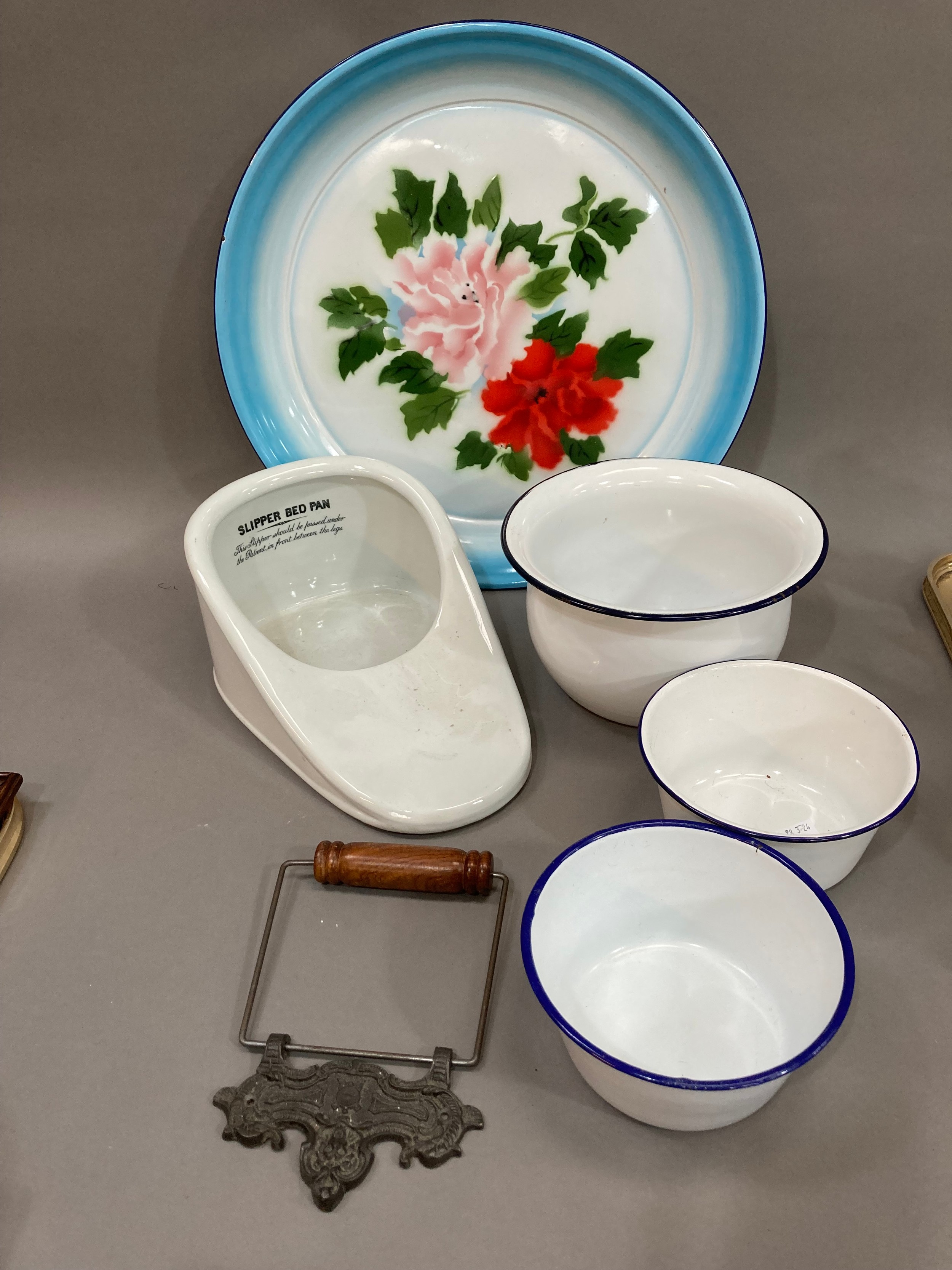 A slipper bed pan by S. Mawson and Sons, London, together with an enamelled chamber pot and two