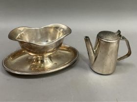 A French Christofle silver plated double lipped sauce boat on integral oval dished stand with beaded