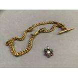 An early 20th century watch chain in gilt base metal curb links with T-bar and swivel fastener,