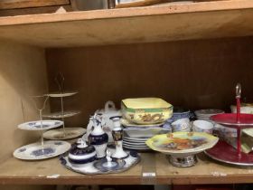 A collection of ceramics comprising a musical fruit dish, cake stands, cheese dish and cover, blue