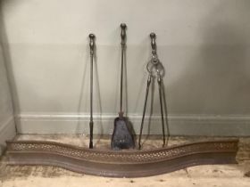 A set of 19th century steel fire irons and a steel curb of serpentine outline and pierced