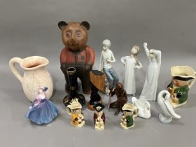 Two Lladro figures of a girl and a boy in nightgowns and a goose, a Lladro style figure of a young