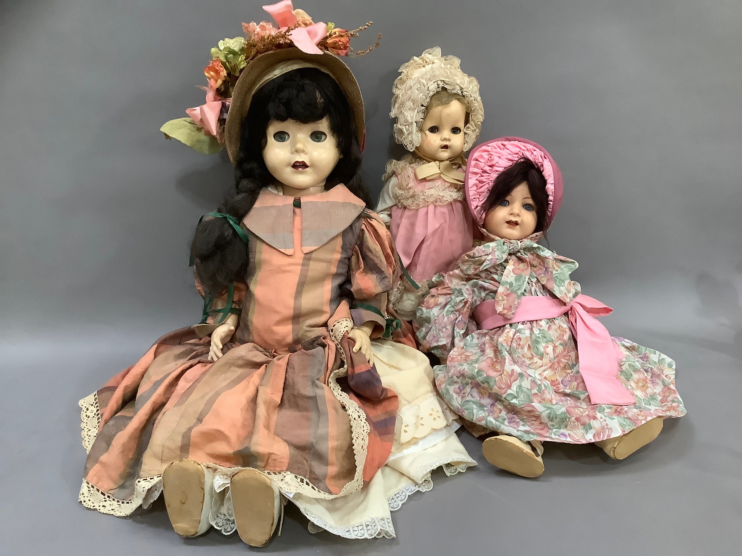 A vintage hard plastic doll by Pedigree with sleeping eyes, open mouth and long brunette hair,