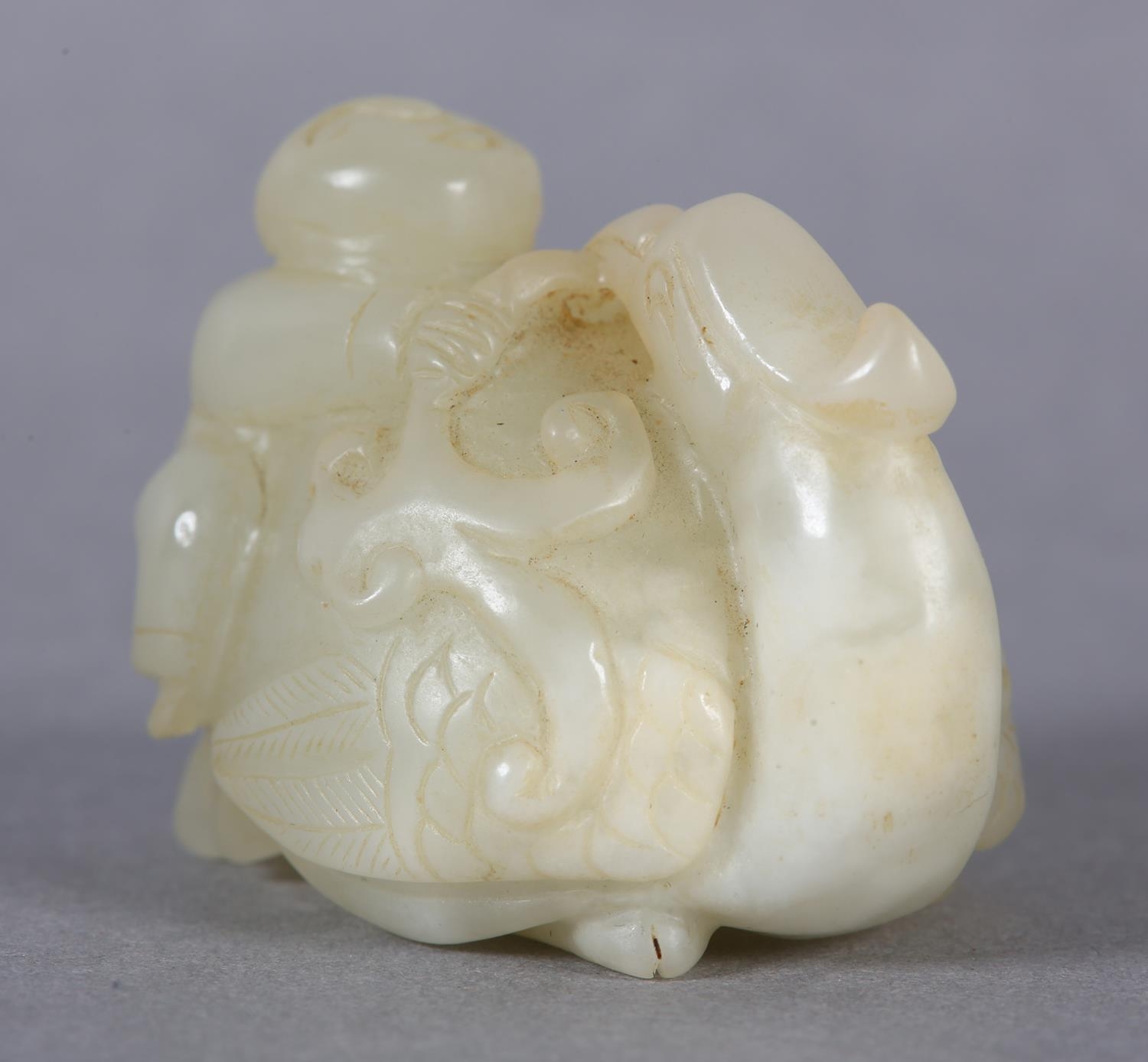 A Chinese jade carving of a boy climbing upon the back of a phoenix with its head turned backwards - Image 4 of 8