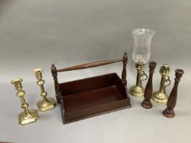 A reproduction book trough with carrying handle together with a pair of treen candlesticks, a pair