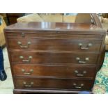 A mahogany bachelor's chest having a pull slide, four graduated drawers with swing handles,