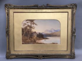 A 19th century watercolour, lake and mountain landscape with figures on the shore, unsigned, 32cm