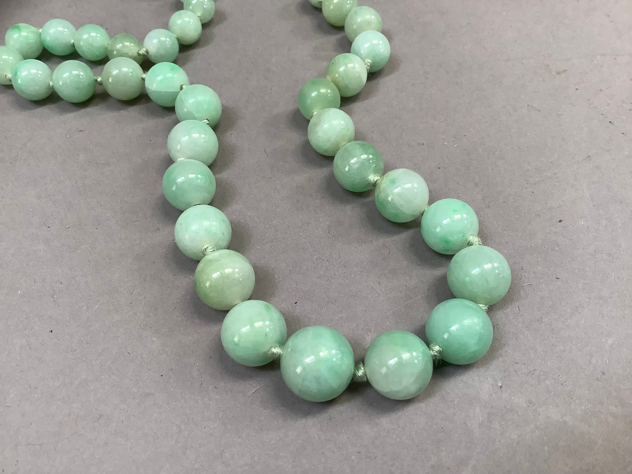 An early to mid 20th century jade necklace of graduated circular stained beads, approximate - Image 4 of 4