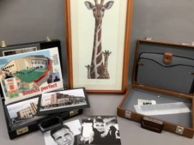 Two faux leather attaché cases and a print of giraffe and young by Warwick Higgs