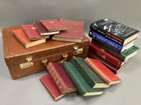 A tan leather briefcase together with a small quantity of books including History of Harrogate,