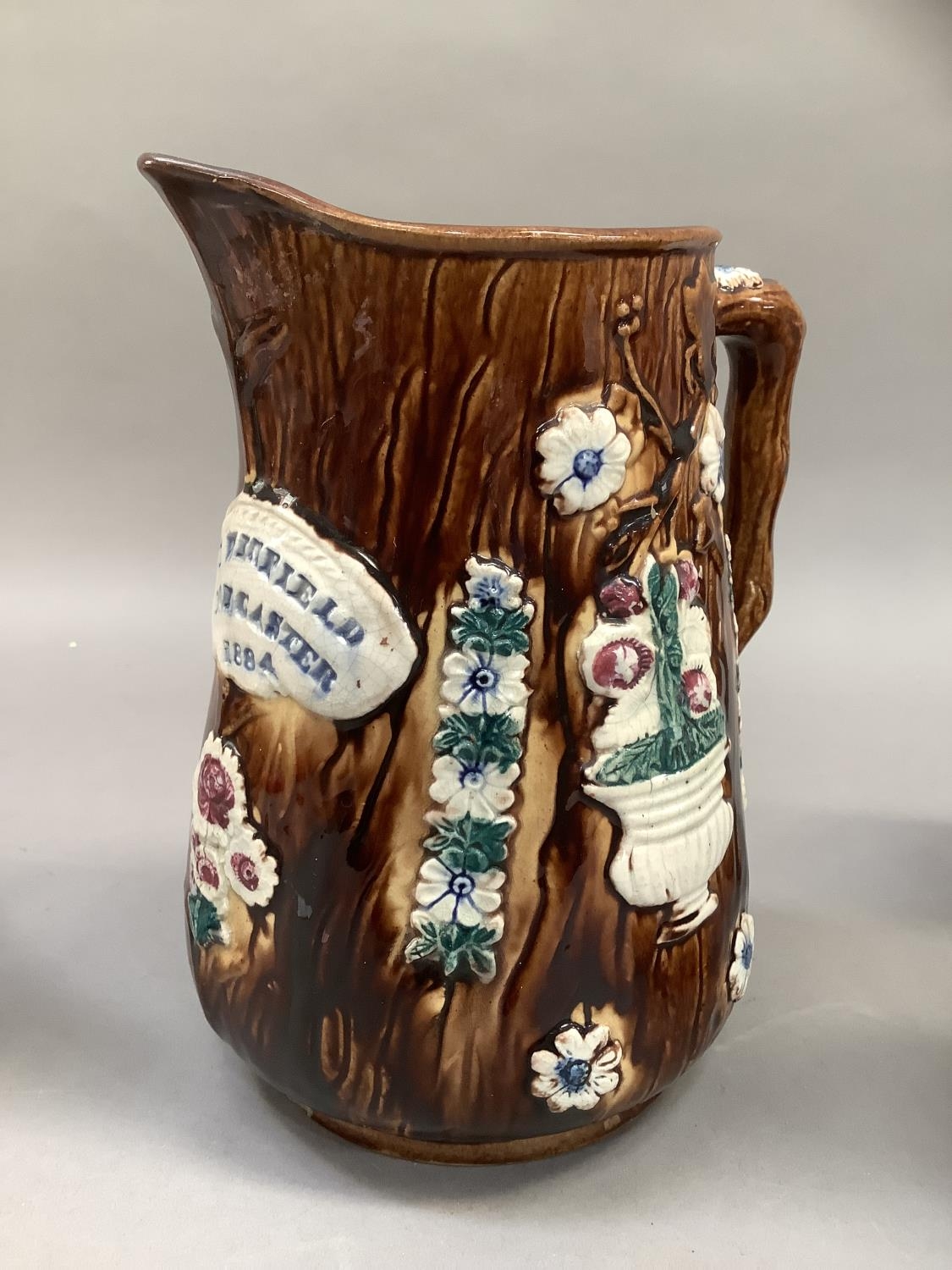 A 19th century barge ware jug the treacle glaze sprigged with urns of flowers, florets and a - Image 2 of 4