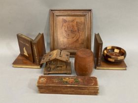 A pair of bookends formed as treen books and a bowl, together with a teak barrel holder, musical