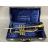 A brass trumpet in fitted case