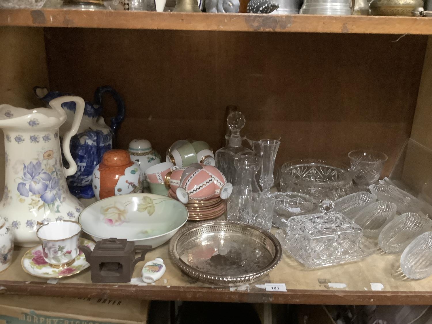 A collection of ceramics comprising toilet jug, ginger jar and cover etc together with a silver