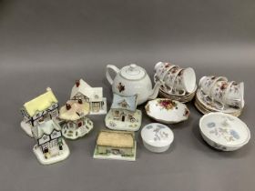 A teaset for four comprising cups and saucers, a floral teapot, two Wedgwood trinket dishes and