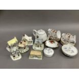 A teaset for four comprising cups and saucers, a floral teapot, two Wedgwood trinket dishes and