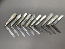 A collection of ten Sheffield silver bladed fruit knives all with mother-of-pearl scales c1884-1924