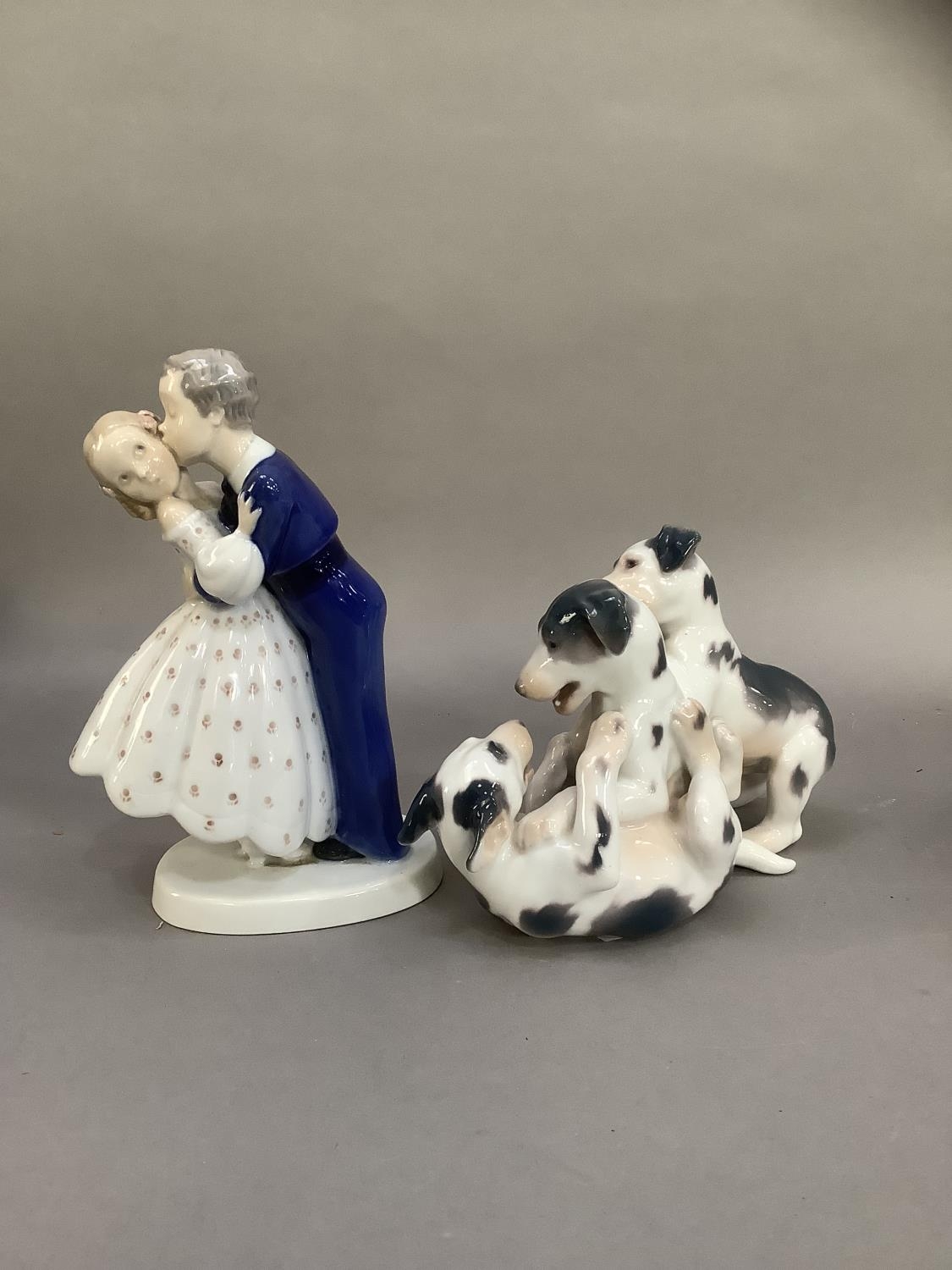 A Bing and Grondahl figure group of three playing terrier pups, no.1815 together with another figure