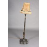 An ebonised and gilt chinoiserie standard lamp, turned column on a square triple stepped base of