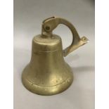 A ship's brass bell, with hanging bracket, 20cm high
