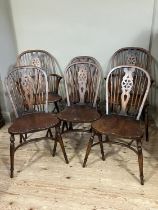 A set of six wheel back dining chairs comprising two carvers and four singles