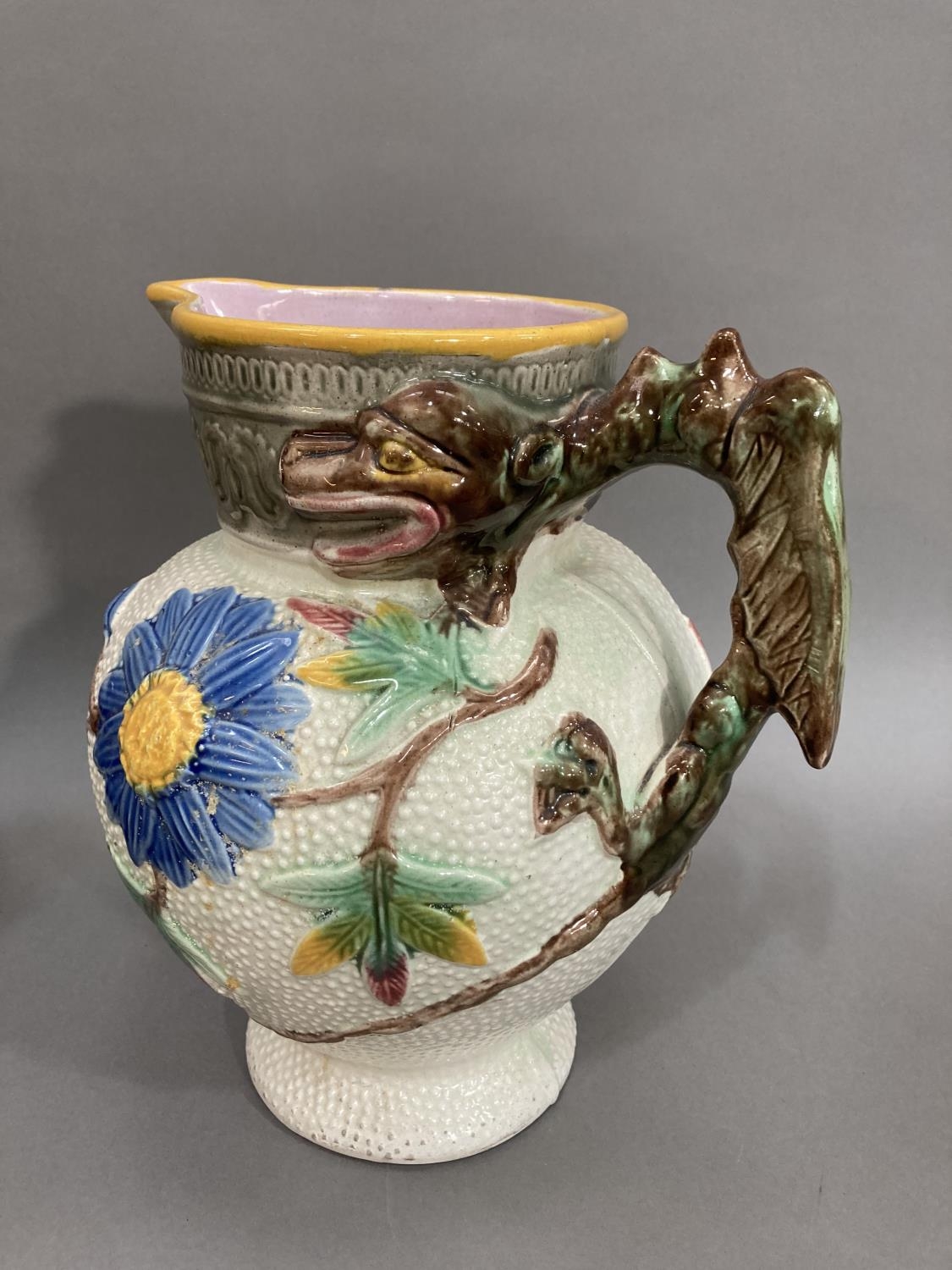 A Majolica moulded jug with dragon handle with daisy's and asters to body, a ceramic model of two - Image 2 of 3