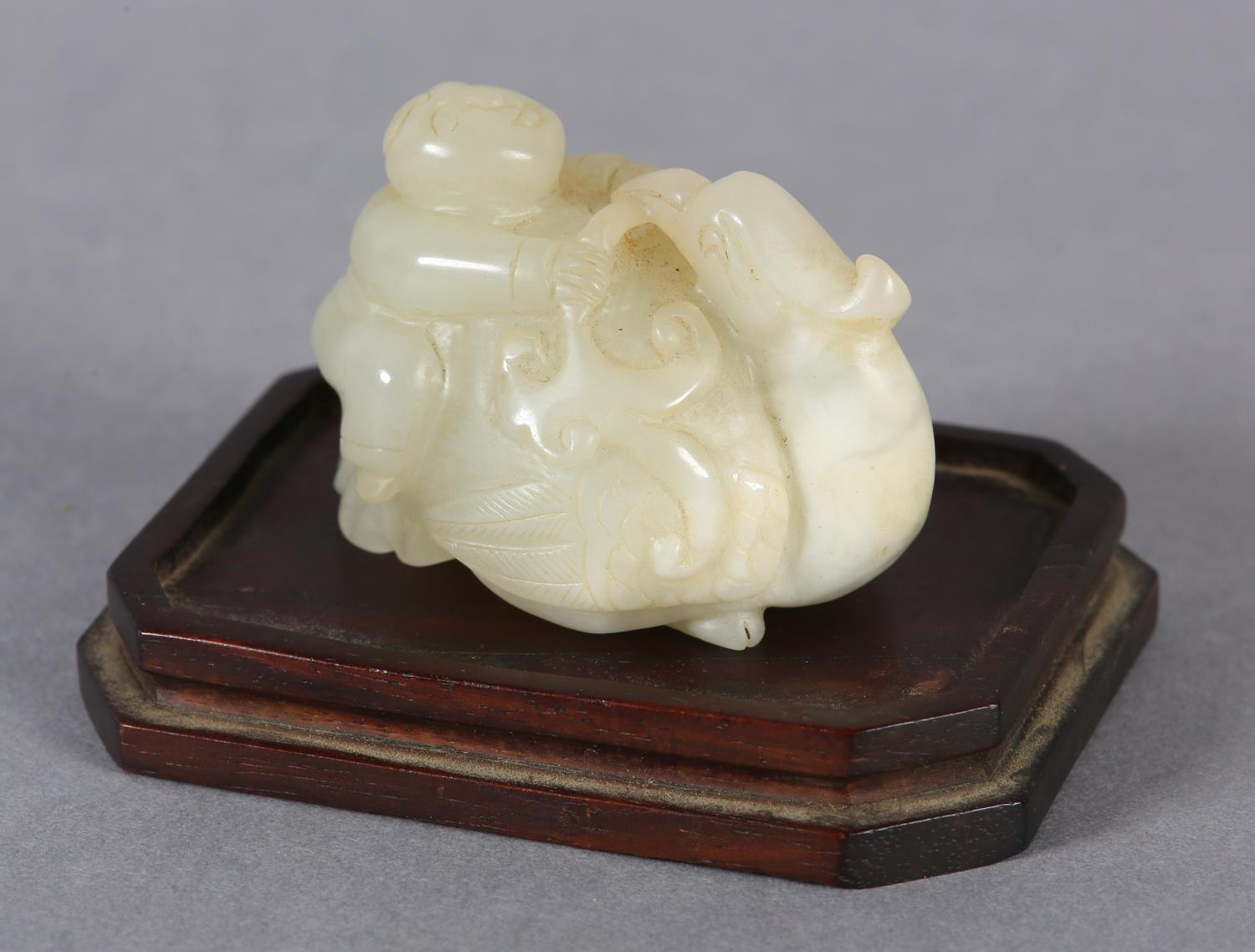 A Chinese jade carving of a boy climbing upon the back of a phoenix with its head turned backwards - Image 2 of 8
