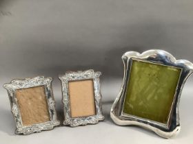 A George V silver fronted picture frame, portrait format with indented outline, Birmingham 1910,