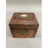 A 19th century walnut tea caddy having cut gilded metal and ivory applied cartouche and gilt metal