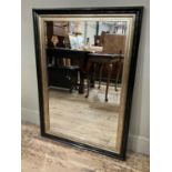 A black and pale gilt framed contemporary rectangular wall mirror, 104cm x 76cm