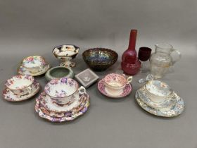 A china cabinet cups and saucers and trios of floral decoration, Grimwade's Royal Winton pedestal