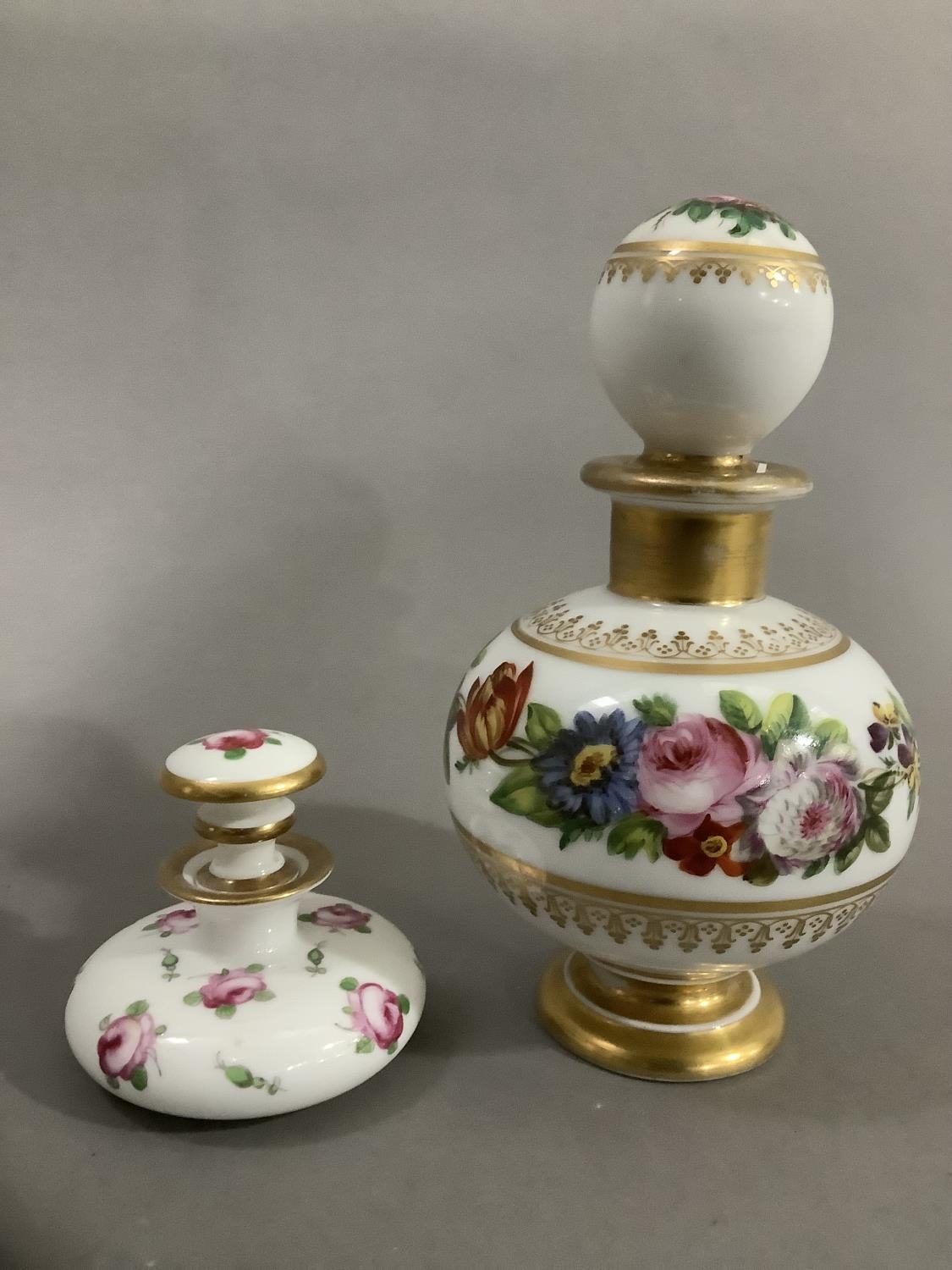 A continental scent bottle with bulbous body and globe stopper, hand painted with sprays of flower - Image 2 of 3