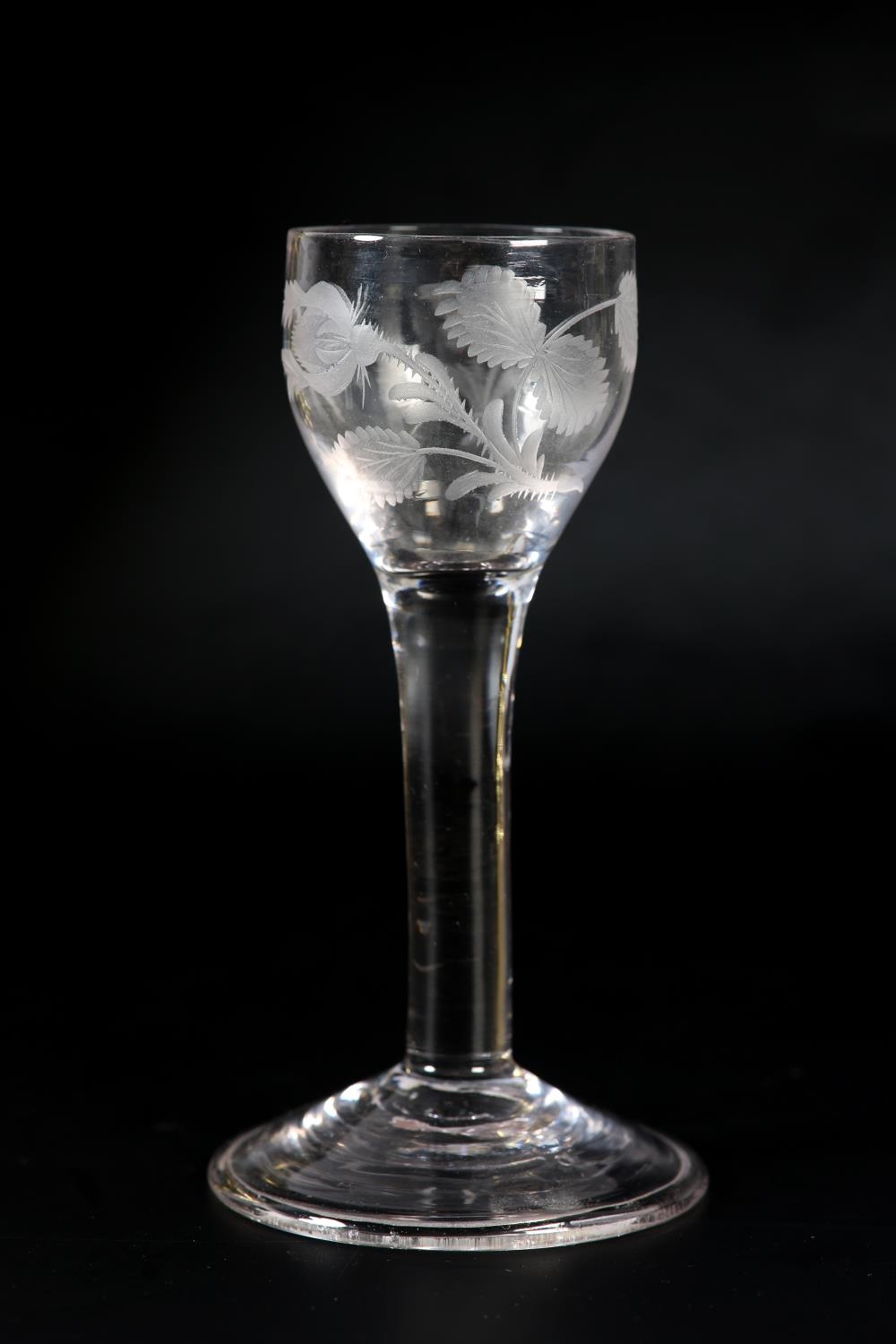 An 18th century wine glass, c1780, the ogee bowl etched with flower and leaves, on plain stem, domed - Image 4 of 5