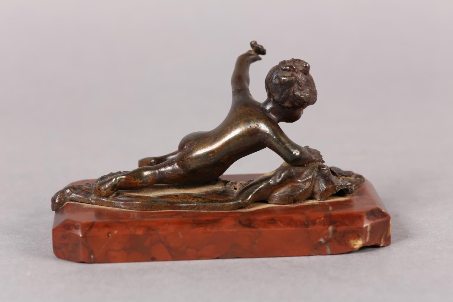 A late 19th century cold painted bronze figure of an infant girl and butterfly, on red marble - Image 3 of 3