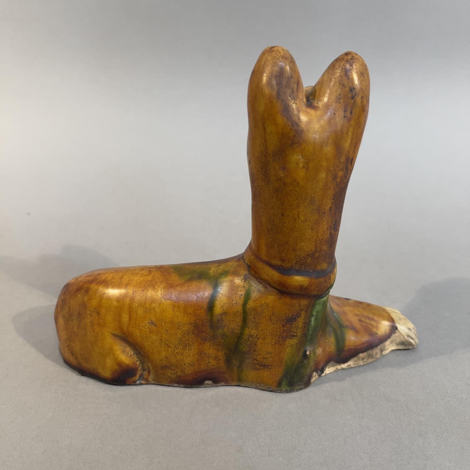 A Tang-style Sancai glazed pottery figure of a recumbent dog 18cm wide x 14cm high (Shipping - Image 2 of 2