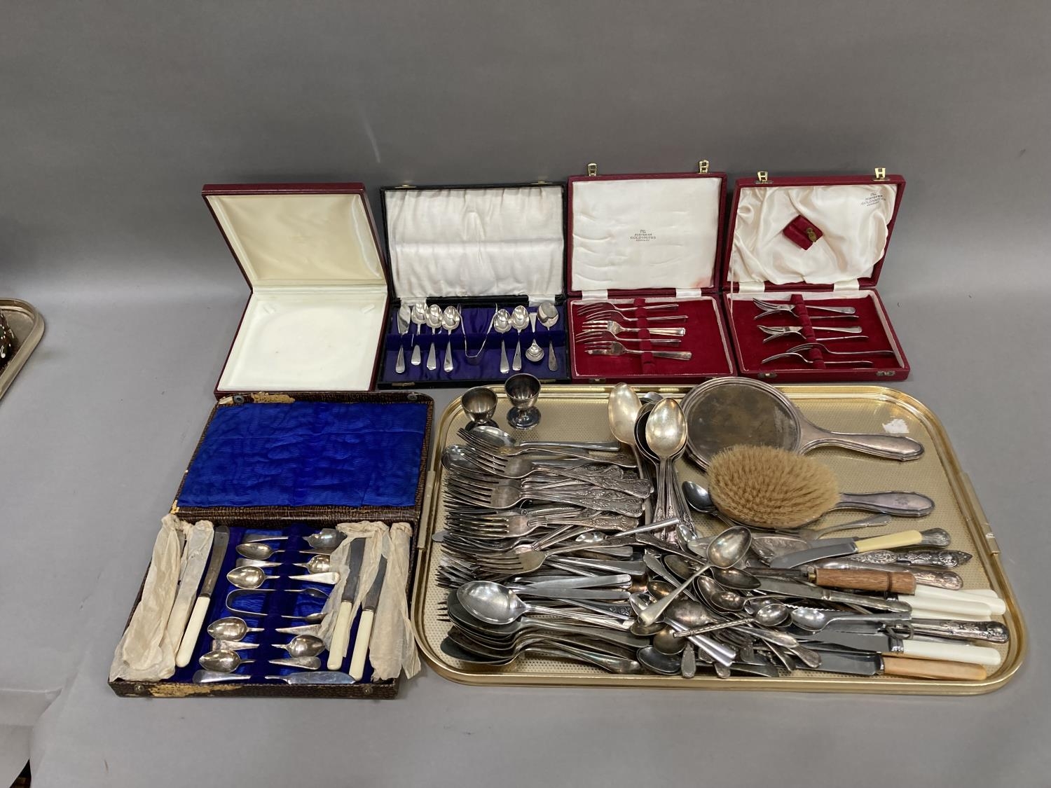 A collection of silver plated and stainless steel flatware including four cased sets
