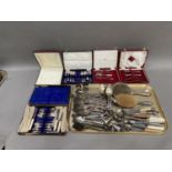 A collection of silver plated and stainless steel flatware including four cased sets