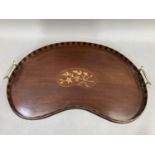 An Edwardian mahogany and satinwood inlaid two handled tray of kidney shape, chequered gallery and