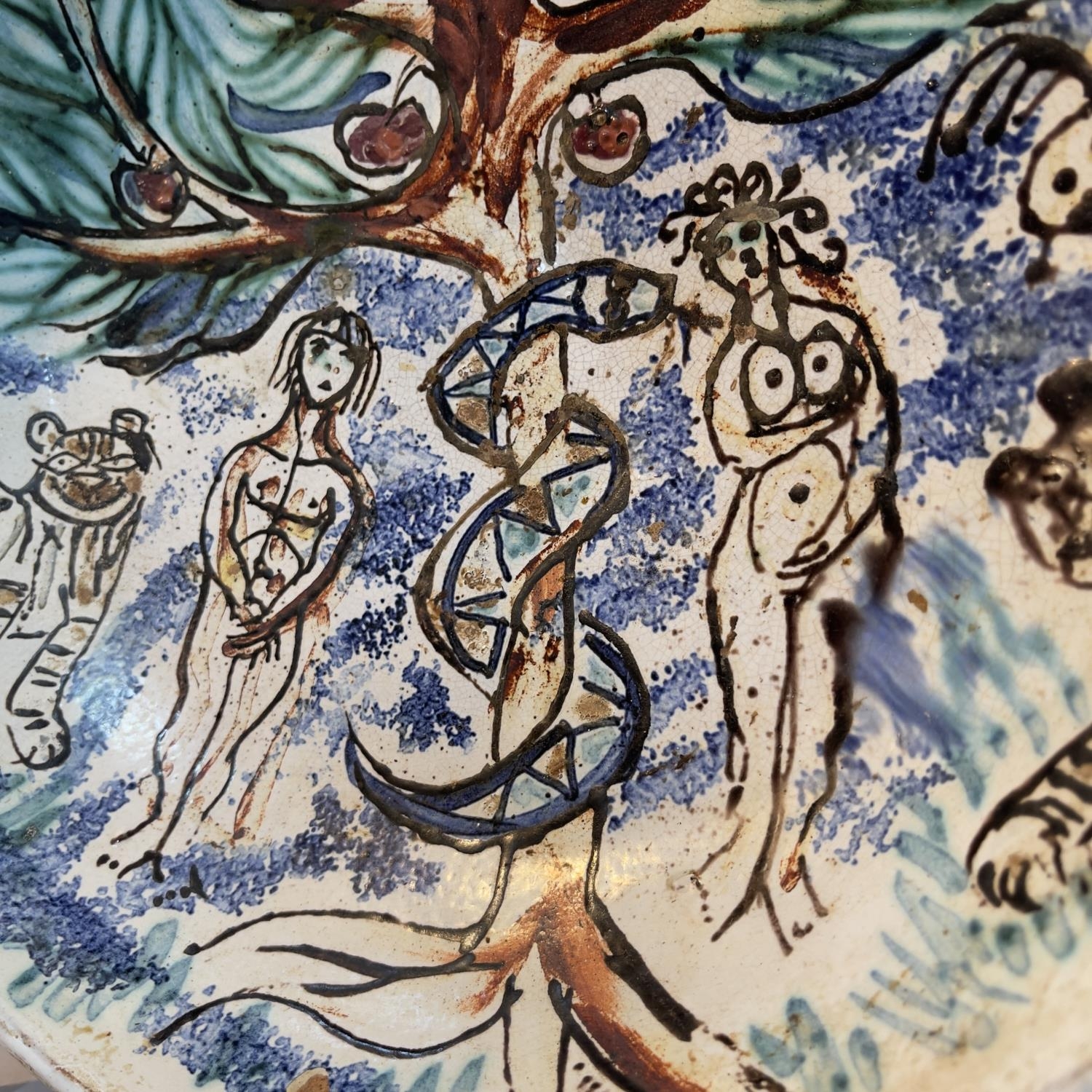 A 20th century earthenware dish painted with the Garden of Eden, with Adam and Eve, the apple tree - Image 2 of 2