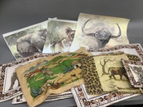 A set of six Kwa Zulu Natal made placemats printed with wild animals, a pan holder and a quantity of